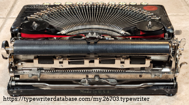 Note the pock-mark "grid" pattern on the platen from the repeated impacts of the sharp period and comma. Note the pock-mark "grid" pattern on the platen from the repeated impacts of the sharp period and comma.