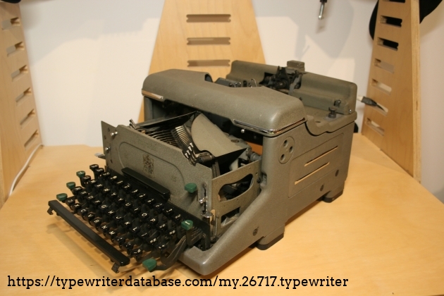 The typewriter half assembled. This picture gives you an idea of how the frame enamel gets chip as to fully remove the keyboard can take a little fiddling to get it out. The typewriter half assembled. This picture gives you an idea of how the frame enamel gets chip as to fully remove the keyboard can take a little fiddling to get it out.