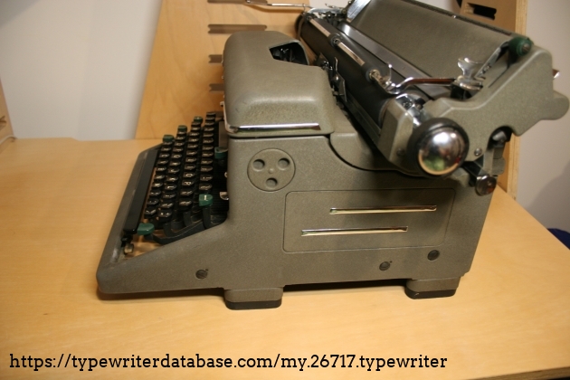 The right hand view of the typewriter. The circle spins and on the inside of the frame there appears to be a gear but it doesn't appear to interface with this keyboard. The right hand view of the typewriter. The circle spins and on the inside of the frame there appears to be a gear but it doesn't appear to interface with this keyboard.