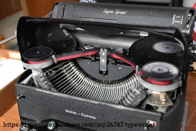 Ribbon cover opened with exposed internals.