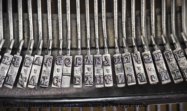 Type slugs showing "1" foundry mark for pica; middle keys.