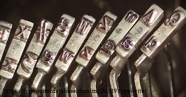 Type slug detail, left end of set, showing foundry marks.