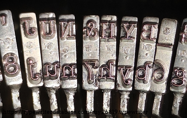 Type slug detail, middle range, showing foundry marks.