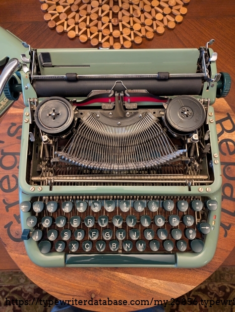 When I got it, the typewriter had one of those gross correction ribbons that is half black and half white correction tape. Thankfully, one of the original DIN spools was included, along with a Smith-Corona style spool that "works".