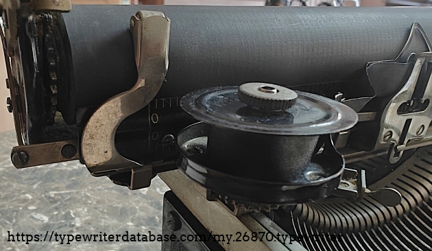 Left paper finger detail.  The right paper finger is missing.