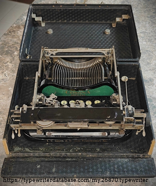 Typewriter folded in case.