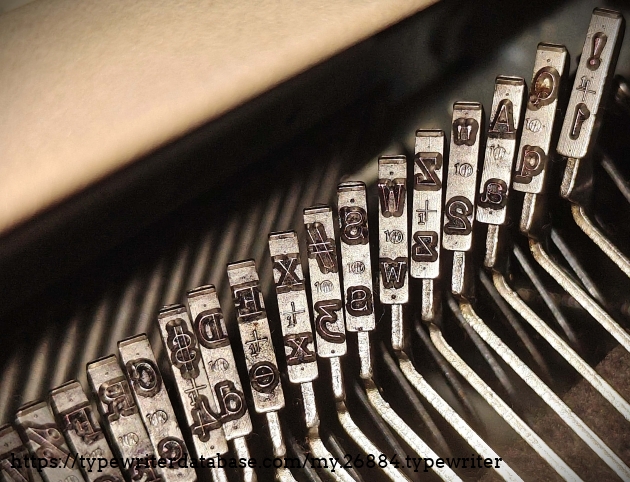 Type slug detail, left end of basket, showing foundry marks.