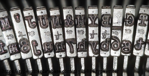 Type slug detail, middle range of basket, showing foundry marks.