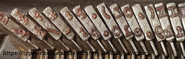 Typebar detail, right set - showing "P" foundry mark for alphabet letter keys, and "10" foundry mark for numeral/character keys.