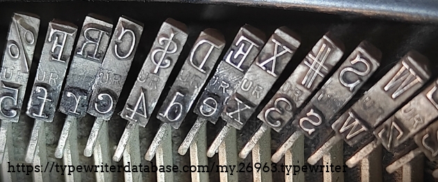 Type slug detail, left-center, showing "UR" foundry marks.