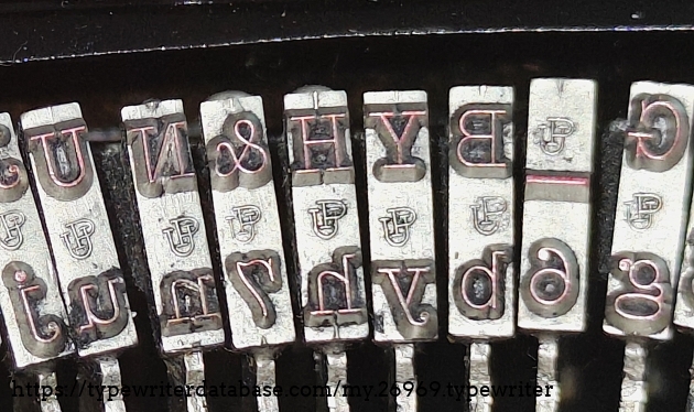 Type slug detail showing "UP" (Underwood Pica?) foundry marks.
