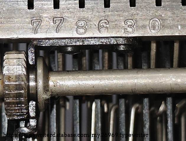 Underside serial number on the linkage bearing mount.  When I first got this machine, I thought this was the actual unit serial number.