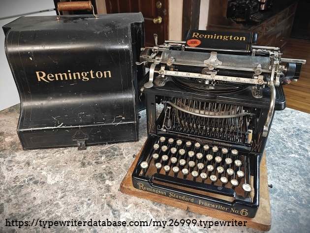 Typewriter and case.