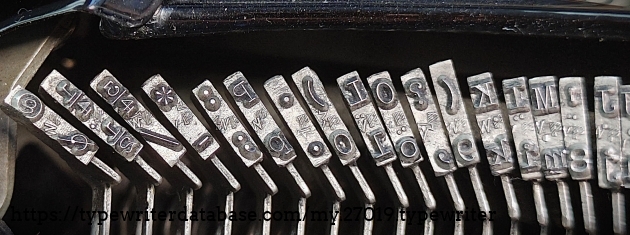 Type slug detail, right end of basket, showing unusual hashed "P" foundry marks.