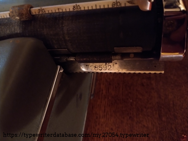 Serial number on the carriage rail. Matches the number stamped on the bottom of the frame