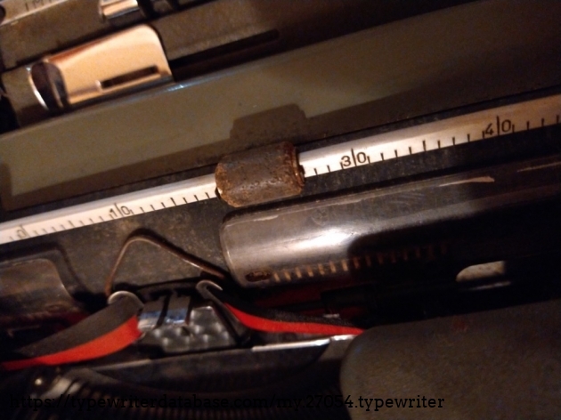 Cork roller on the paper bale. All the feed rollers are cork too.