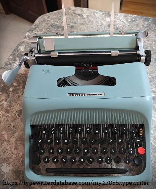 Front, carriage return lever and paper rests deployed.