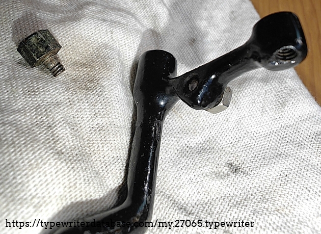 Dog assembly detail showing broken rocker stop nut.