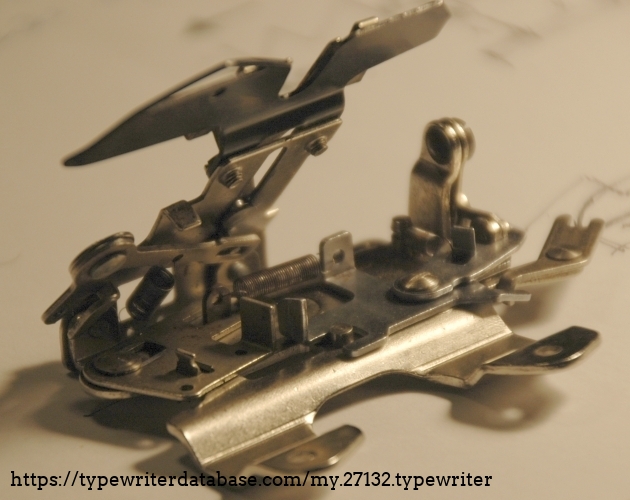 the cleaned escapament assembly with CR (left), ribbon hopper (top) and escapement (right)