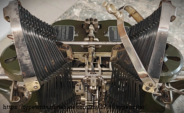 Detail of typebar towers, carriage and front panel off.