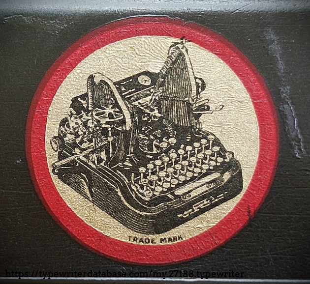 Detail of Oliver typewriter decal on paper table.