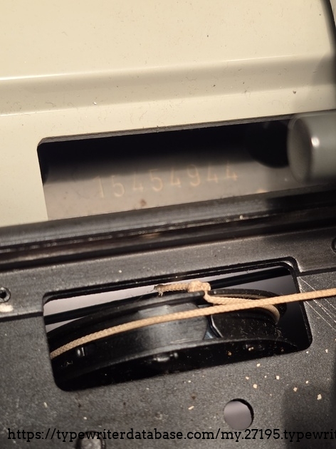 The serial number. It is a bit hidden under the carriage on the left side.