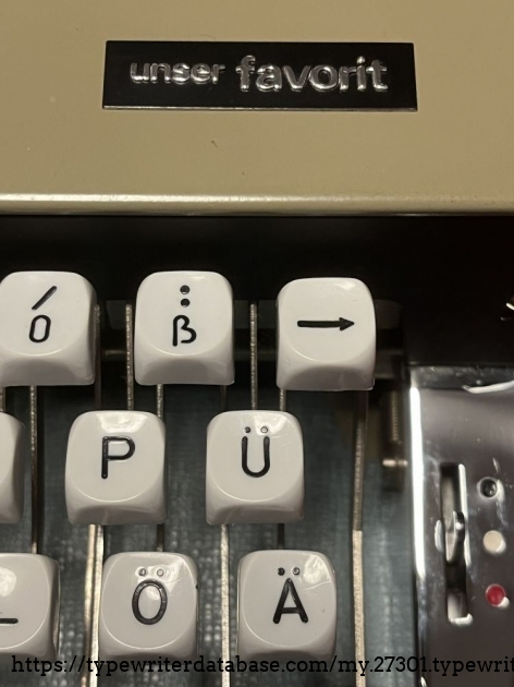 Detail: Manufacturer's plate and German special letters: &auml;, &ouml;, &uuml;, &szlig;