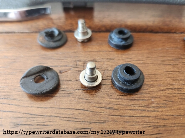 The old and new rubber bushings that attach between the main body shell and the typewriter chassis.