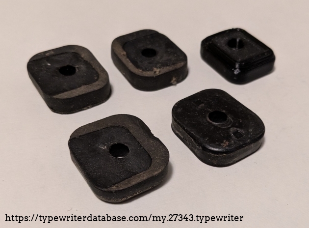 The old pads that go between the frame and the rail the feet are attached to compared to a new 3D printed pad.