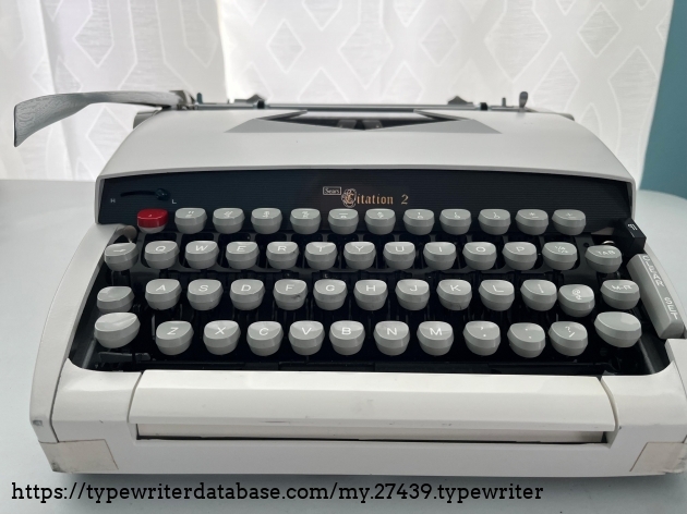 Front view.  Identifying keys are the red #1, the black paragraph indent key, and tab set/clear.