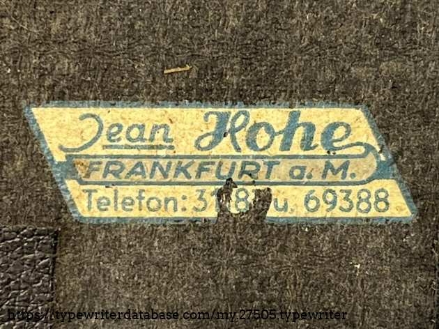Detail: vendor badge on case bottom: Jean Hohe, Frankfurt am Main; five-digit phone numbers have been unavailable there for a few days now...