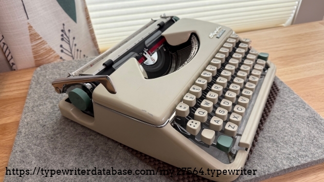 Side view showing the scrape in the paint. It is not in the position of the carriage return lever, so I don't know how it happened.