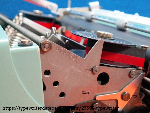 The broken lever of the carriage lock system is visible in this photo.