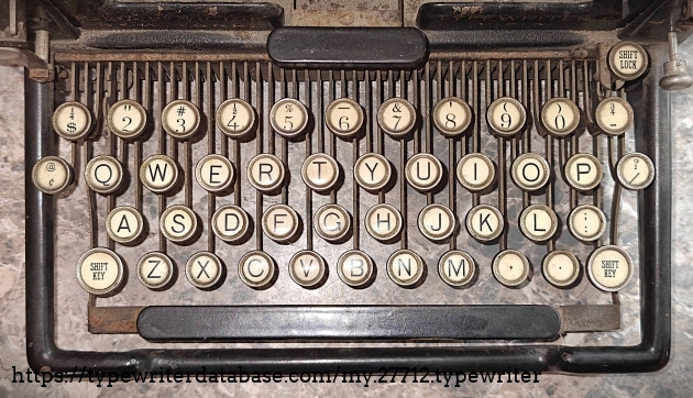 Keyboard.  Some unusual character placements observed, such as the "1/2" character as the upper case of "4".