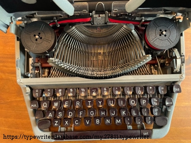 Cover up, good felt on underside. Loaded with black/red nylon ribbon