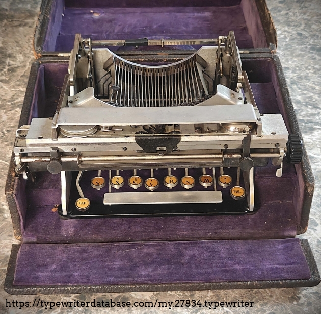 Typewriter folded in its case.