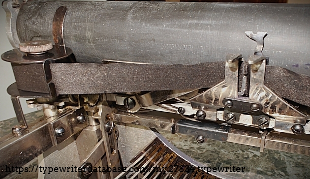 Ribbon detail.  The ribbon vibrator adjustment is the blued metal slider, with one screw, slightly below and to the right of center.