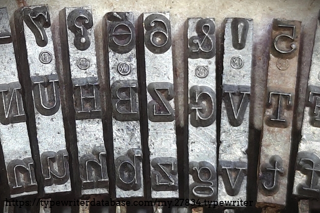 Detail of type slugs, center.  Note the "circle k" foundry mark on Corona and Smith-Corona typewriters got its start way back in the day of the Standard Folding!