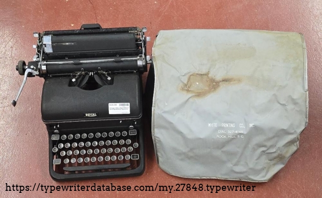 Dust cover and typewriter side-by-side.