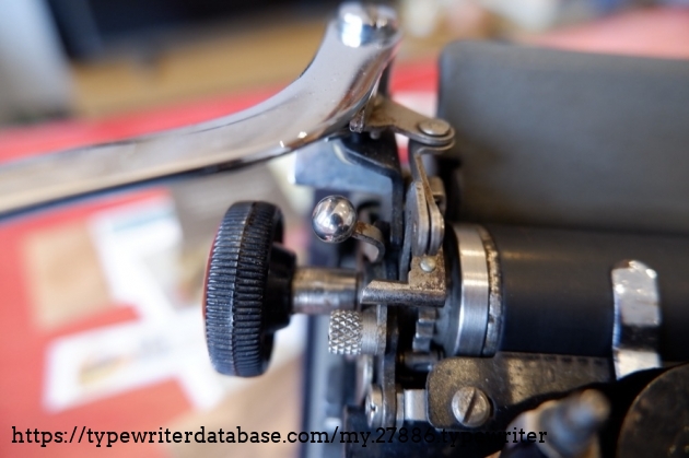 Carriage lock lever (round), and index selector (knurled)