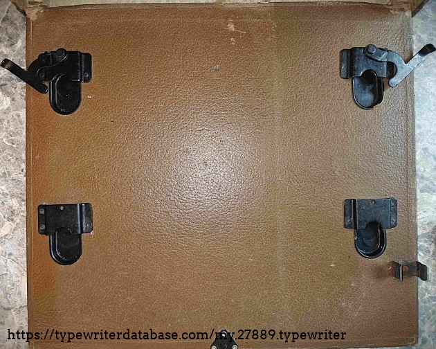 Case mounts for the typewriter.