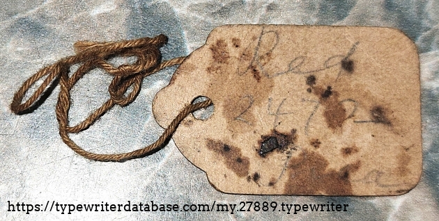 Tag found in cleaning kit case.  The words "Red", "Pica", and a numeral can just be made out.