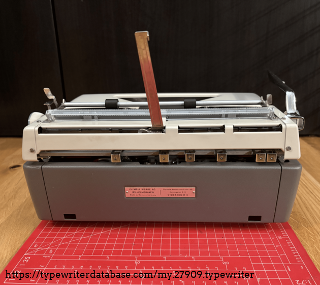 Plate text:
OLYMPIA WERKE AG
WILHELMSHAVEN
Made in Western Germany
-
Olympia Kontorsmaskiner AB
Kungsgatan 6, IV
STOCKHOLM C