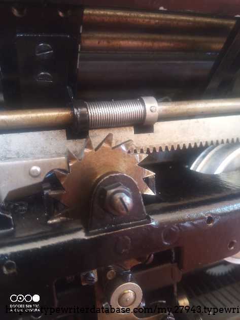 The Orga A38 features a brass-and-cast-iron gear pawl with uneven profiles. It appears to be handcrafted, in contrast to the mass-produced models where the gears look like they were machine-stamped on a press.