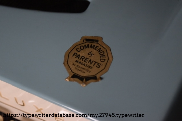 Sticker on ribbon cover.