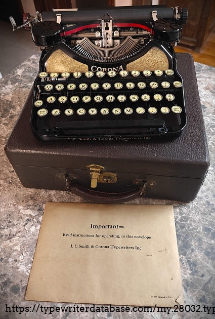 Typewriter and case.