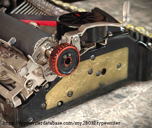 Left rear quadrant.  For some reason, the left platen knob has red undertones.