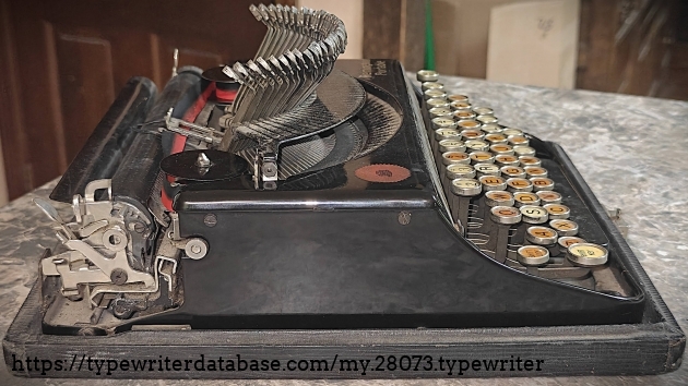 Left broadside with typebars extended.
