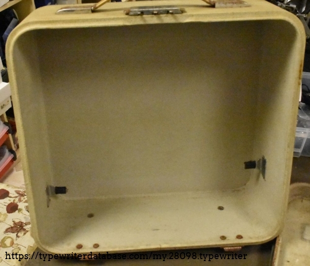 The inside of the lid isn't bad, but the metal hardware is quite rusty.