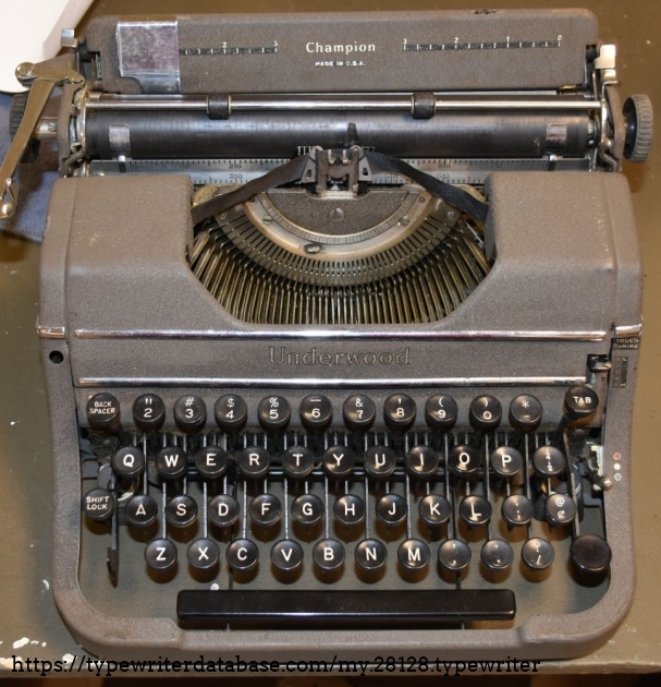 Note the missing margin release button on the front left, and the canted paper table - due to the hinge on the right side being broken off.